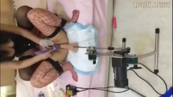 Asian ladies playing with a shit and a fuck machine